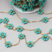 Catena acciaio oro con fiore cristalli turchese 10 mm conf. 50 cm