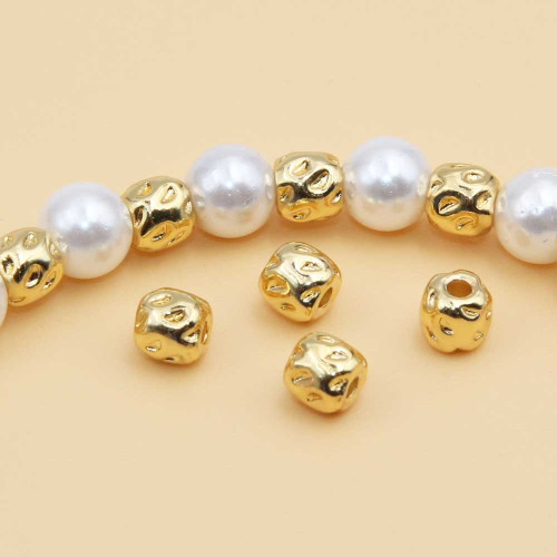 Distanziatori barilotto decorato gold plated 4 mm 20 pz