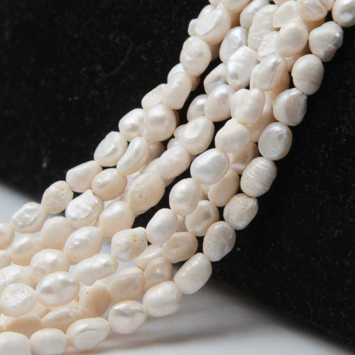 Perle chicco di riso 6 mm bianche filo35 cm