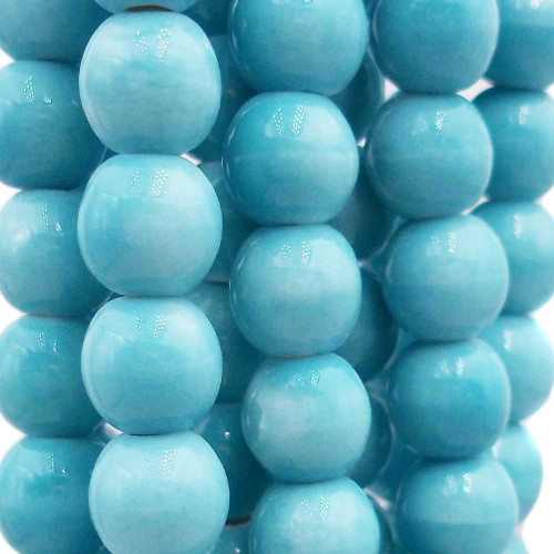 Perline in ceramica turchese 8.2x7.4 mm filo 32 cm